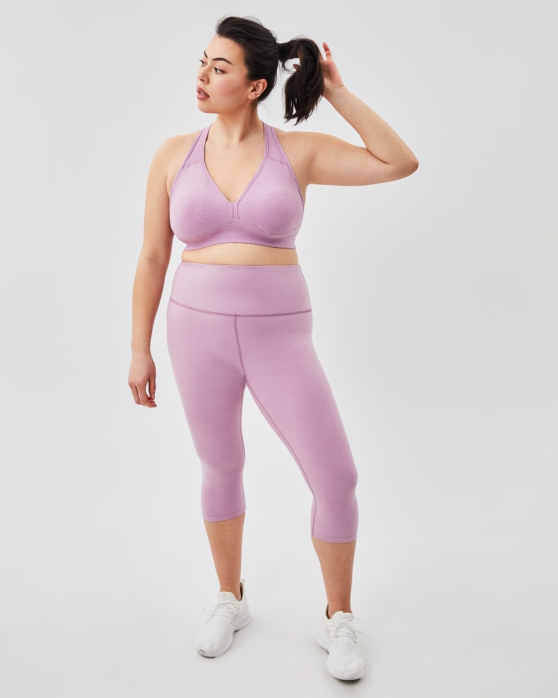 Plus size model with rectangle body shape wearing Dalary Plunging Sports Bra by Beyond Yoga | Dia&Co | dia_product_style_image_id:156845